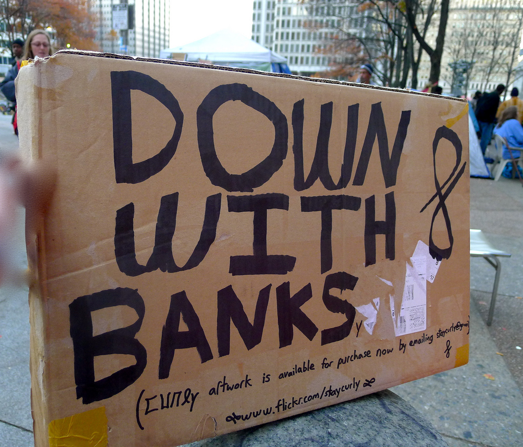 caption: A sign at the Occupy Philly protest.