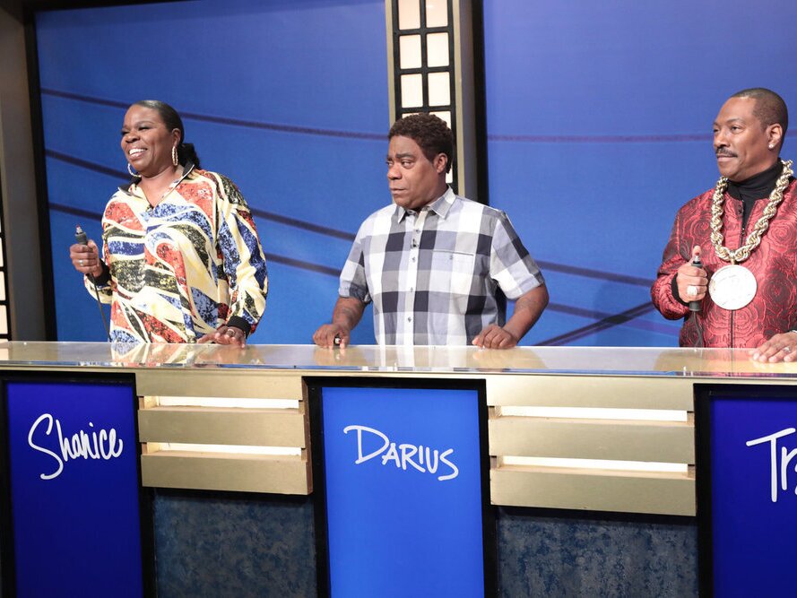 caption: Pictured: (L-R) Leslie Jordan, Tracy Morgan and Eddie Murphy during the "Black Jeopardy" sketch during "SNL50: The Anniversary Special."