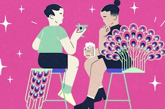 Illustration of two people sitting on bar stools, turned toward one another. The person on the left has a peacock tail coming off the back of their stool. The person on the right has peacock feathers framing the back of their chair. They are surrounded by sparkles and sit in front of a dark pink background.