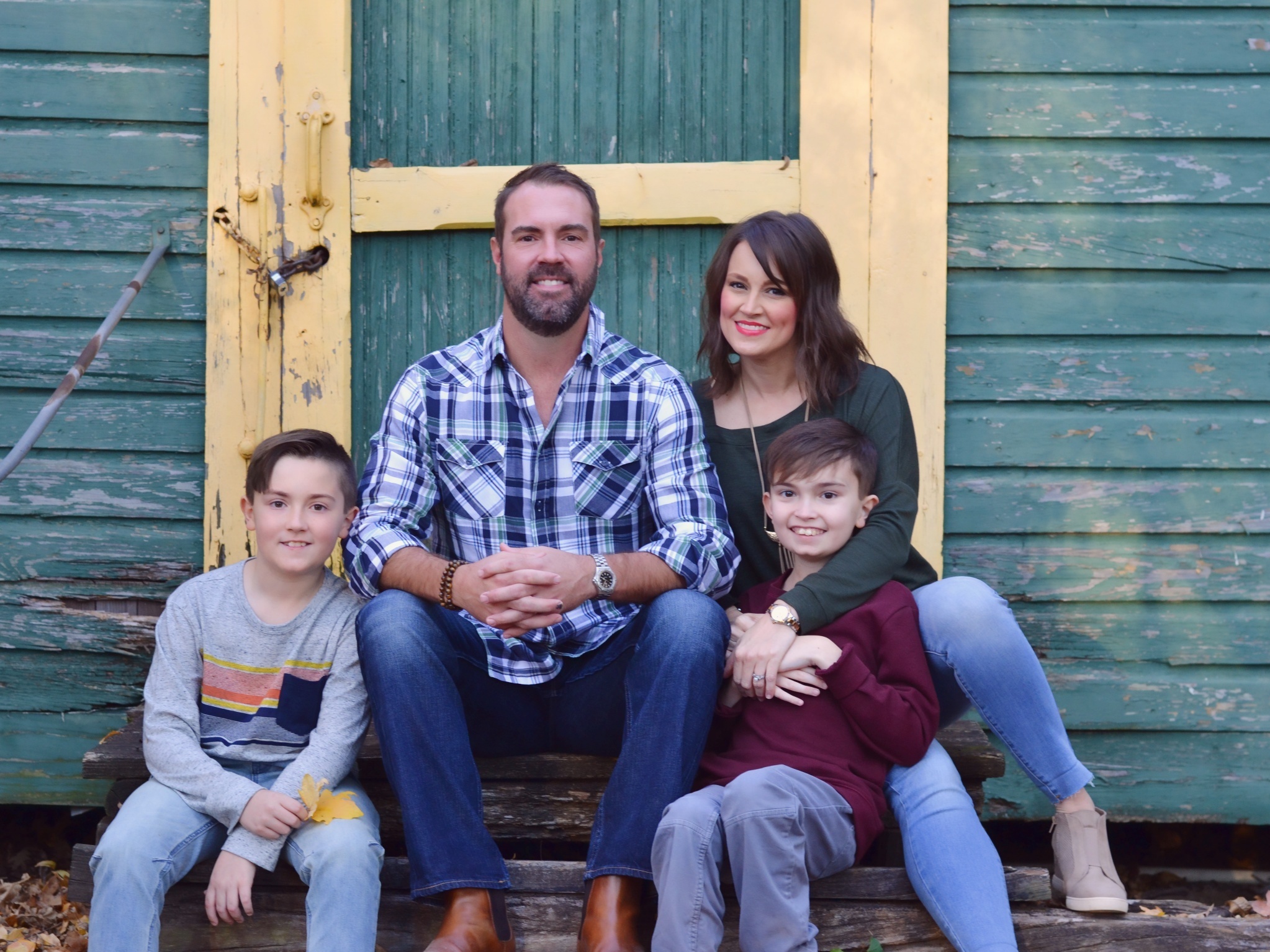 caption: Brittany Schwaigert, her husband, Ryan, 13-year-old Greyson (far right) and 10-year-old Lachlan pose for a family portrait.