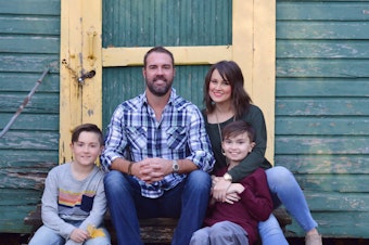 caption: Brittany Schwaigert, her husband, Ryan, 13-year-old Greyson (far right) and 10-year-old Lachlan pose for a family portrait.