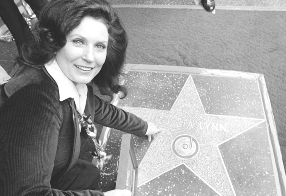 caption: Country music singer Loretta Lynn points to her Hollywood Walk of Fame star during induction ceremonies in Hollywood, Calif., on Feb. 8, 1978. Lynn, the Kentucky coal miner’s daughter who became a pillar of country music, died Tuesday at her home in Hurricane Mills, Tenn. She was 90. 