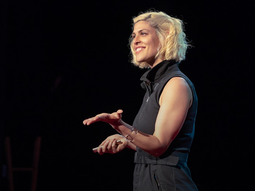 caption: Dessa on the TED stage.