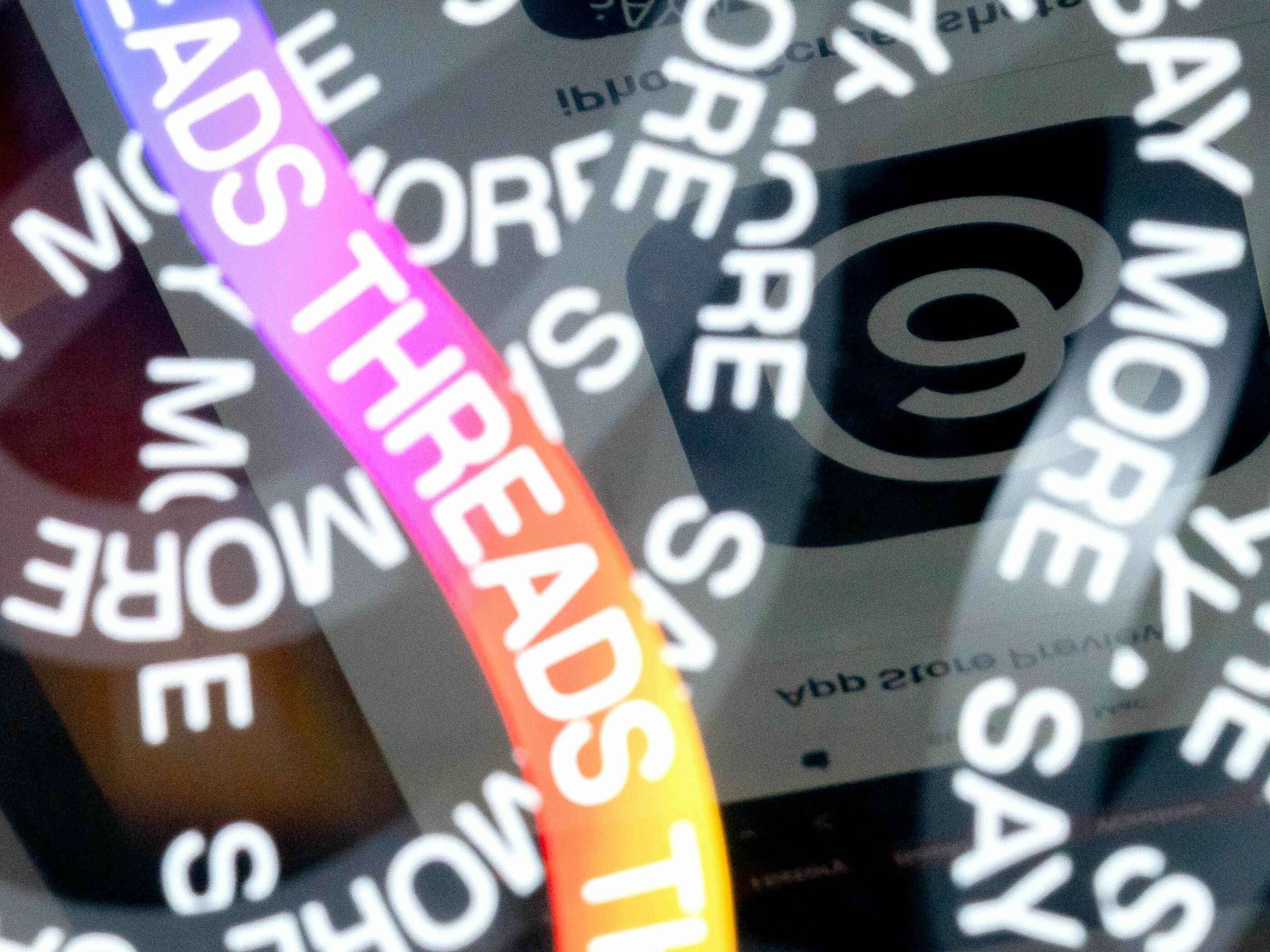 caption: A photo illustration shows the logo for Meta's Threads, an app that gained over 10 million users overnight.