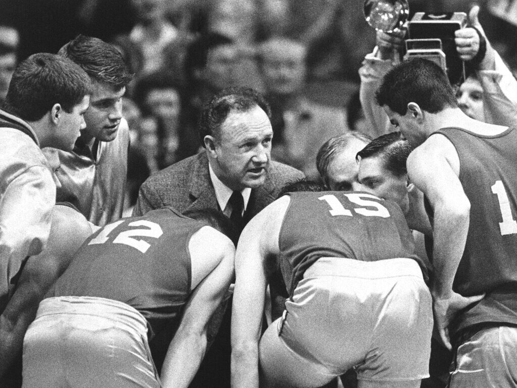 caption: Gene Hackman as coach Norman Dale on the set of 1986's <em>Hoosiers</em>. (Twentieth Century Fox/Getty)