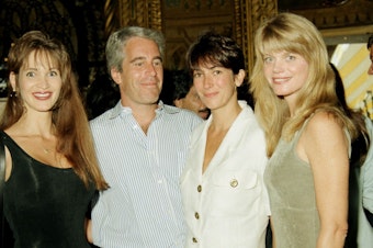 caption: Ghislaine Maxwell, seen here at center right with the disgraced late financier Jeffrey Epstein, gave a deposition in 2016 that should be released, an appeals court says. Maxwell is seen here with Epstein and others a party at the Mar-a-Lago club in Palm Beach.