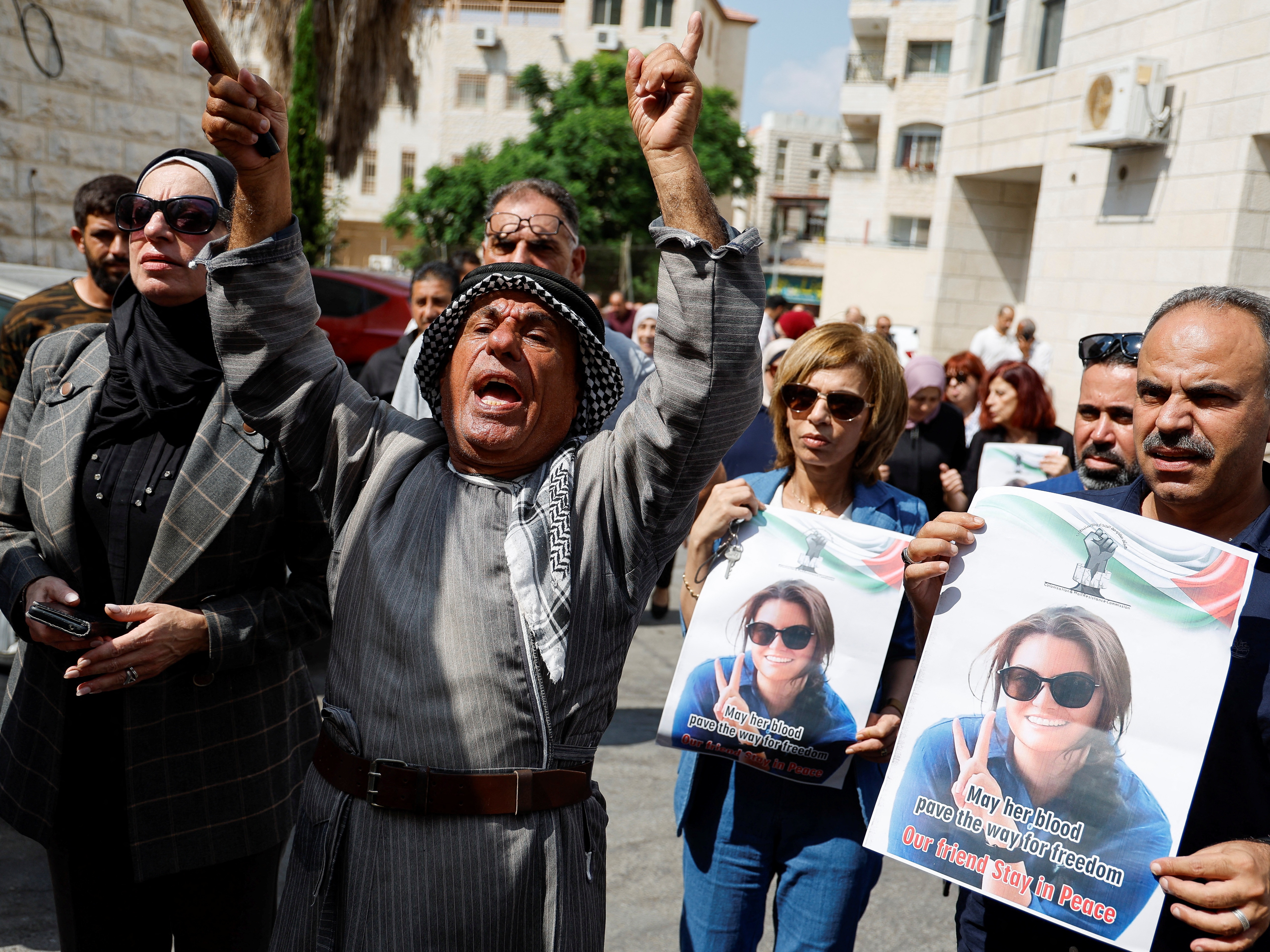 caption: Palestinians march to honor Turkish American activist Aysenur Eygi in Nablus, in the Israeli- occupied West Bank, on Sunday. Witnesses say Israeli forces shot Eygi dead during a pro-Palestinian demonstration Friday.