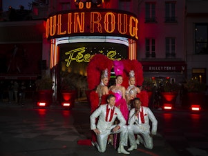 caption: Moulin Rouge dancers perform at the 130th Anniversary Le Moulin Rouge celebration on October 6, 2019 in Paris, France.