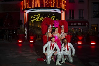 caption: Moulin Rouge dancers perform at the 130th Anniversary Le Moulin Rouge celebration on October 6, 2019 in Paris, France.