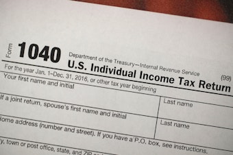A copy of an IRS 1040 tax form is seen at an H&R Block office in Florida in December 2017.