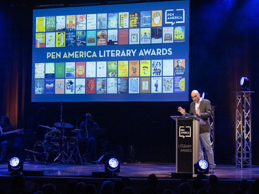 caption: Playwright Ayad Akhtar on stage at the 2023 PEN America Literary Awards in his role as then-president of the organization.