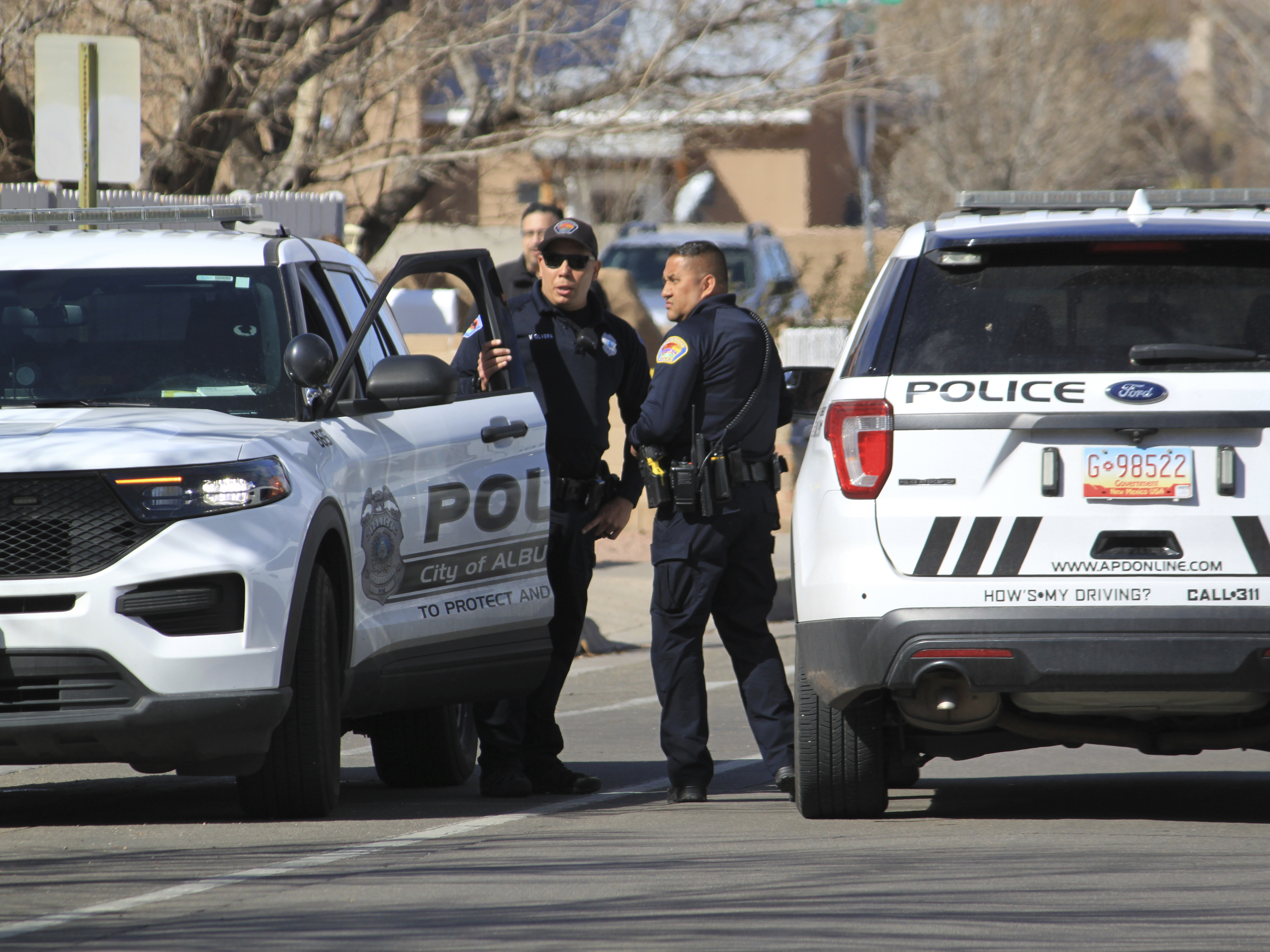 caption: Police work outside of a home in Albuquerque, N.M., on Feb. 23. Critics say problems with training are attributed to higher levels of police killings in New Mexico.