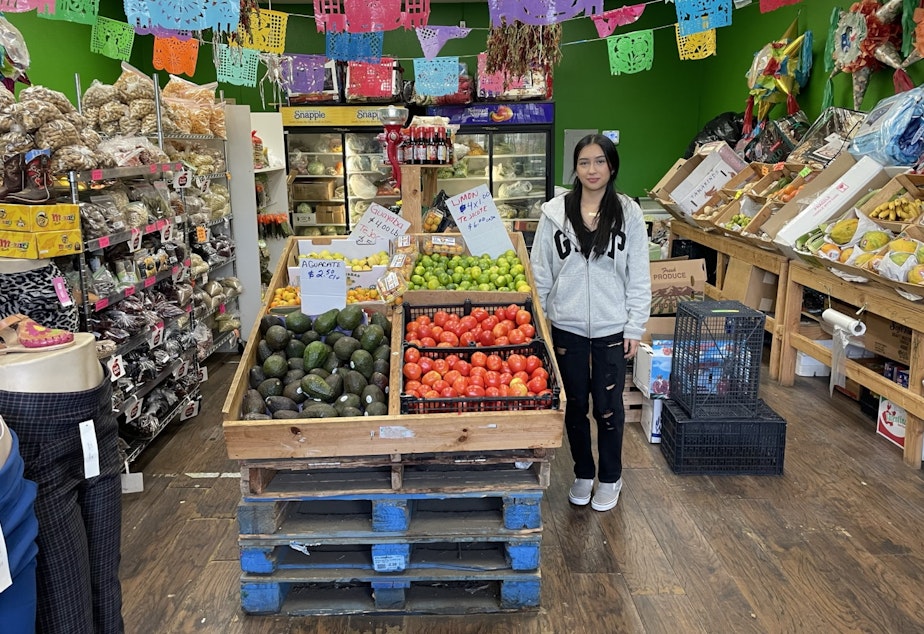 caption: Jennifer Ochoa works at her parents' store, Fruteria Sandoval, in South Park