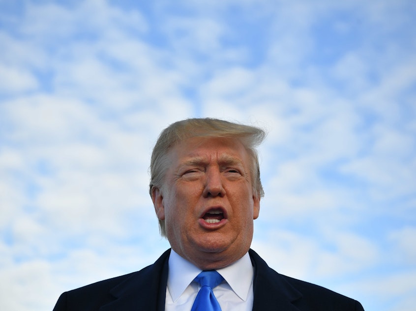 caption: President Trump has a 41% approval rating, according to a new NPR/<em>PBS</em> <em>NewsHour</em>/Marist Poll.