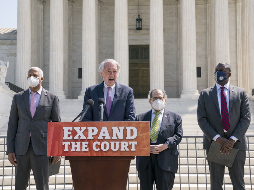 caption: From left, Rep. Hank Johnson, D-Ga., Sen. Ed Markey, D-Mass., House Judiciary Committee Chairman Jerrold Nadler, D-N.Y., and Rep. Mondaire Jones, D-N.Y., hold a news conference outside the Supreme Court to announce legislation to expand the number of seats on the high court.