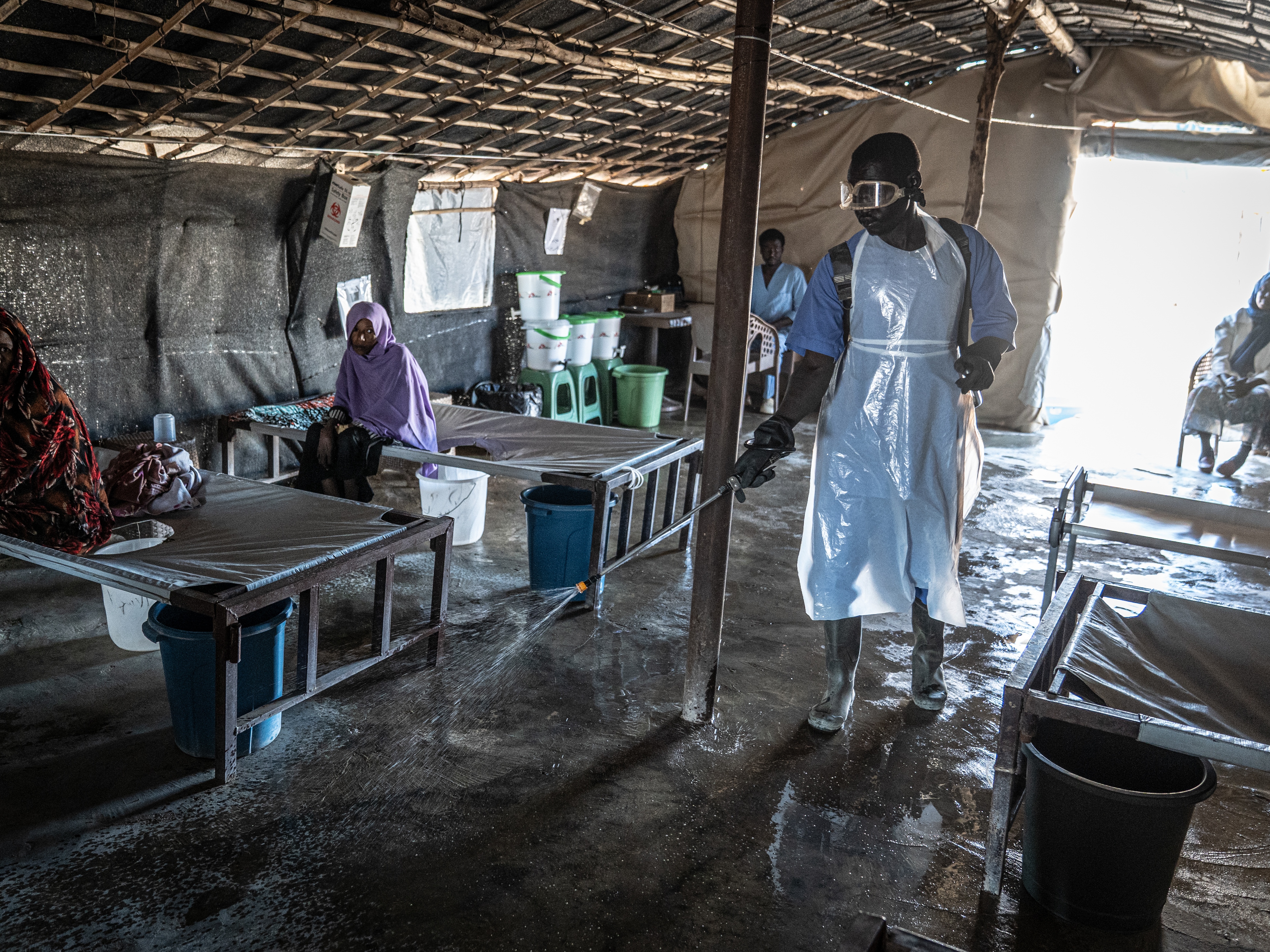 caption: In Gedaref, Sudan, a former bus station is serving as a cholera clinic. Many of the patients are Sudanese who have been displaced by the country's civil war.