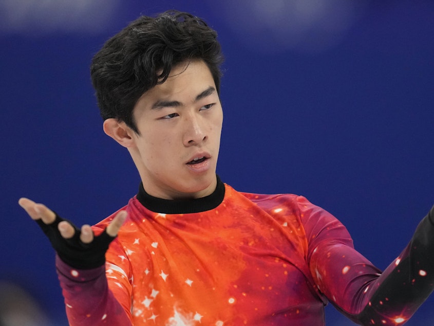 caption: Nathan Chen competes at the 2022 Winter Olympics, Thursday, Feb. 10, 2022, in Beijing. Chen and the rest of Team USA are now gold medal winners in the team event following a doping decision against Russian Kamila Valieva.