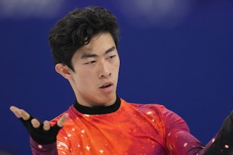 caption: Nathan Chen competes at the 2022 Winter Olympics, Thursday, Feb. 10, 2022, in Beijing. Chen and the rest of Team USA are now gold medal winners in the team event following a doping decision against Russian Kamila Valieva.