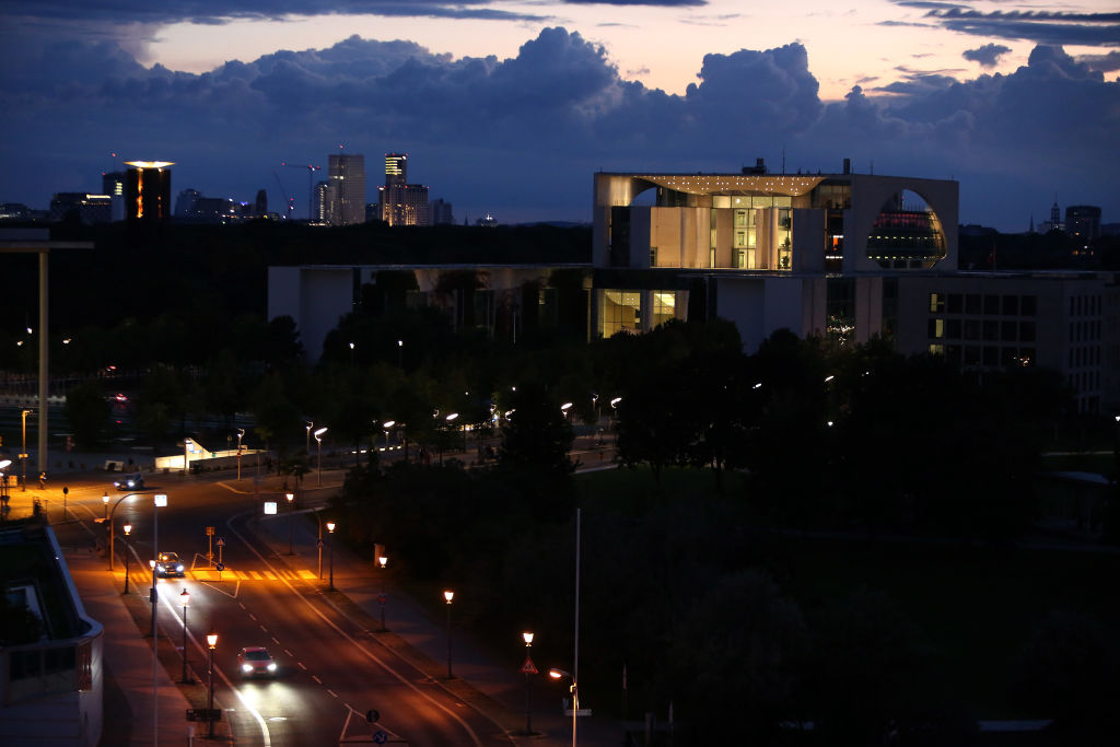 caption: Traffic passes the mostly-dimmed German federal Chancellery in the evening on September 10, 2022 in Berlin, Germany. (Adam Berry/Getty Images)