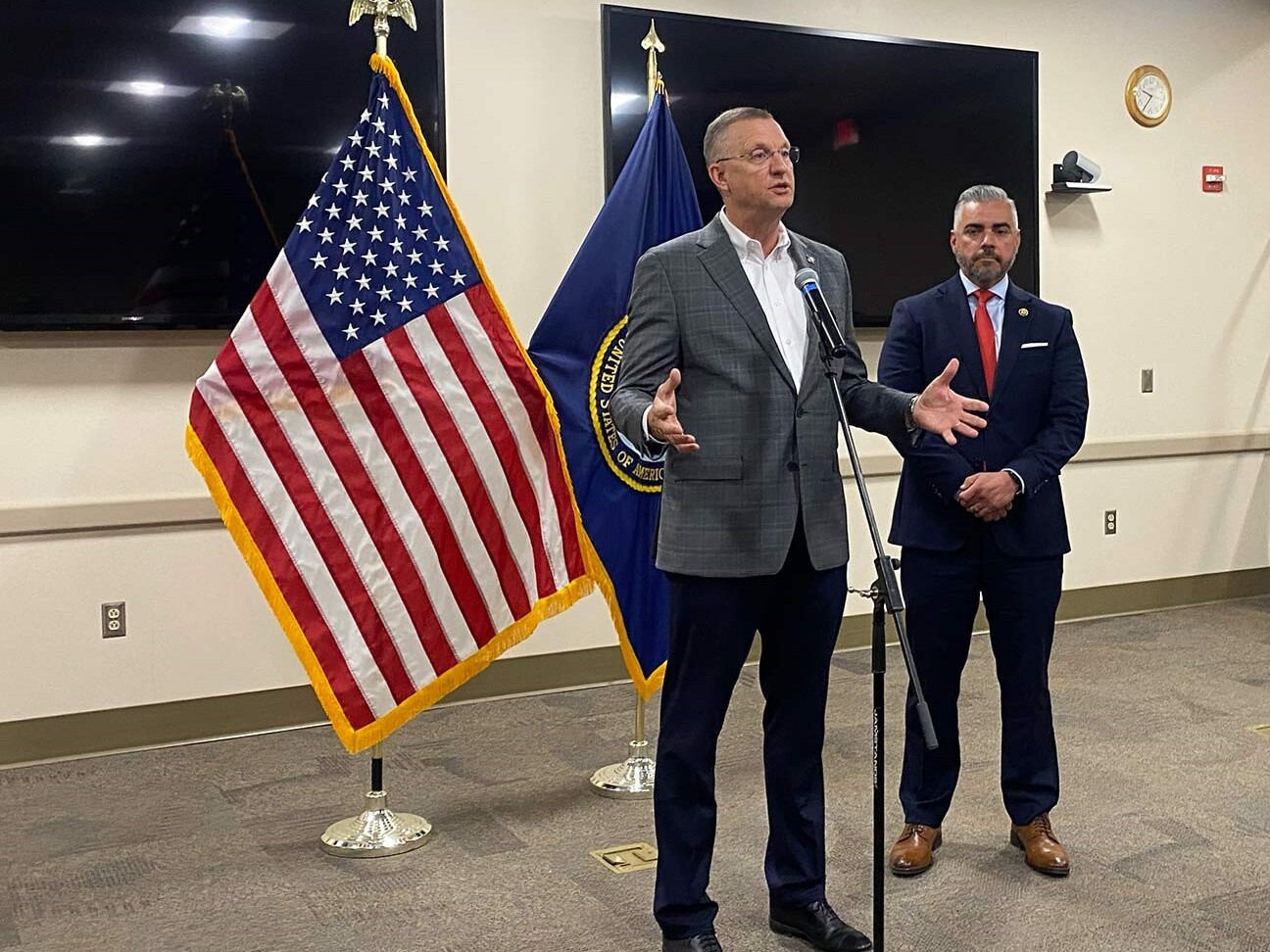caption: Secretary of Veterans Affairs Doug Collins and Rep. Juan Ciscomani of Arizona at the Tucson VA Medical Center on April 28.