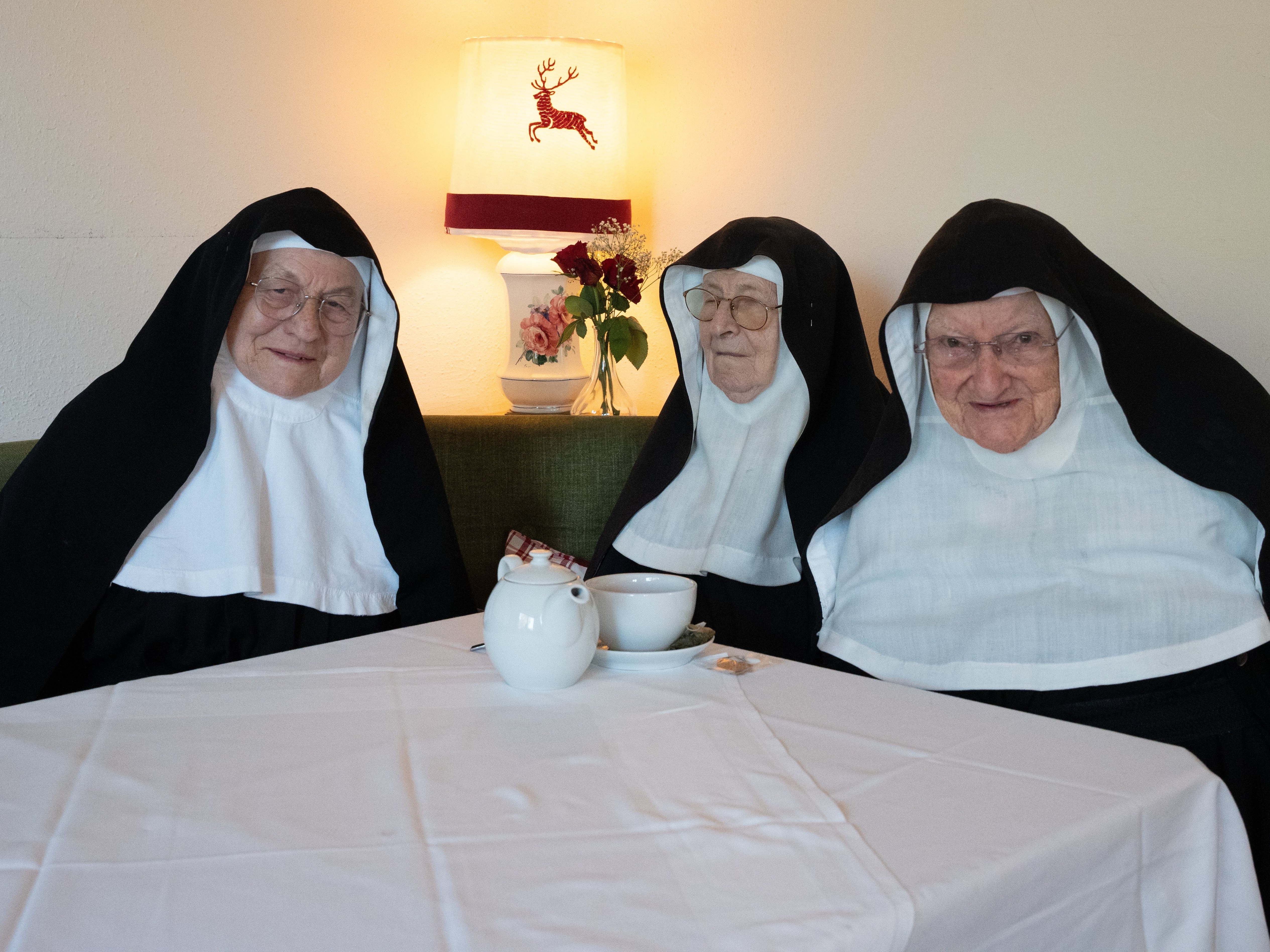 caption: Sister Rita, 82, (left), Sister Regina, 86 (center) and Sister Bernadette, 88, broke into their former convent earlier this year after fleeing a care home they say church authorities took them to live in against their will. The nuns have rejected an offer to remain in the convent if they quit social media, among other conditions. Now their superior has asked the Vatican to step in.