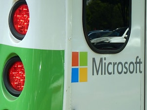 caption: Microsoft is trying to put the brakes on its greenhouse gas emissions.