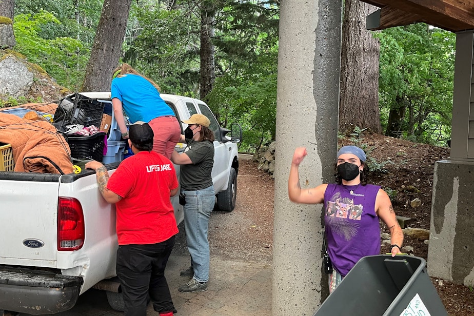 caption: North Cascades Environmental Learning Center staff gather personal belongings and program supplies during a brief Aug. 6, 2023, visit to the campus the Sourdough Fire had forced them to evacuate four days earlier.