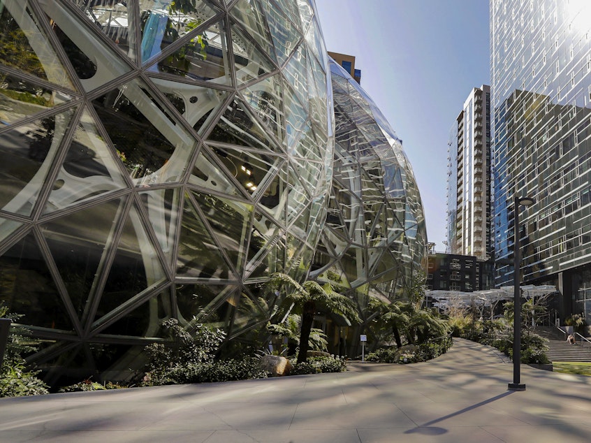 caption: Amazon CEO Andy Jassy said corporate employees will be required to return to the office at least three days a week. Here, the Amazon campus outside the company headquarter in Seattle is pictured in March 2020.