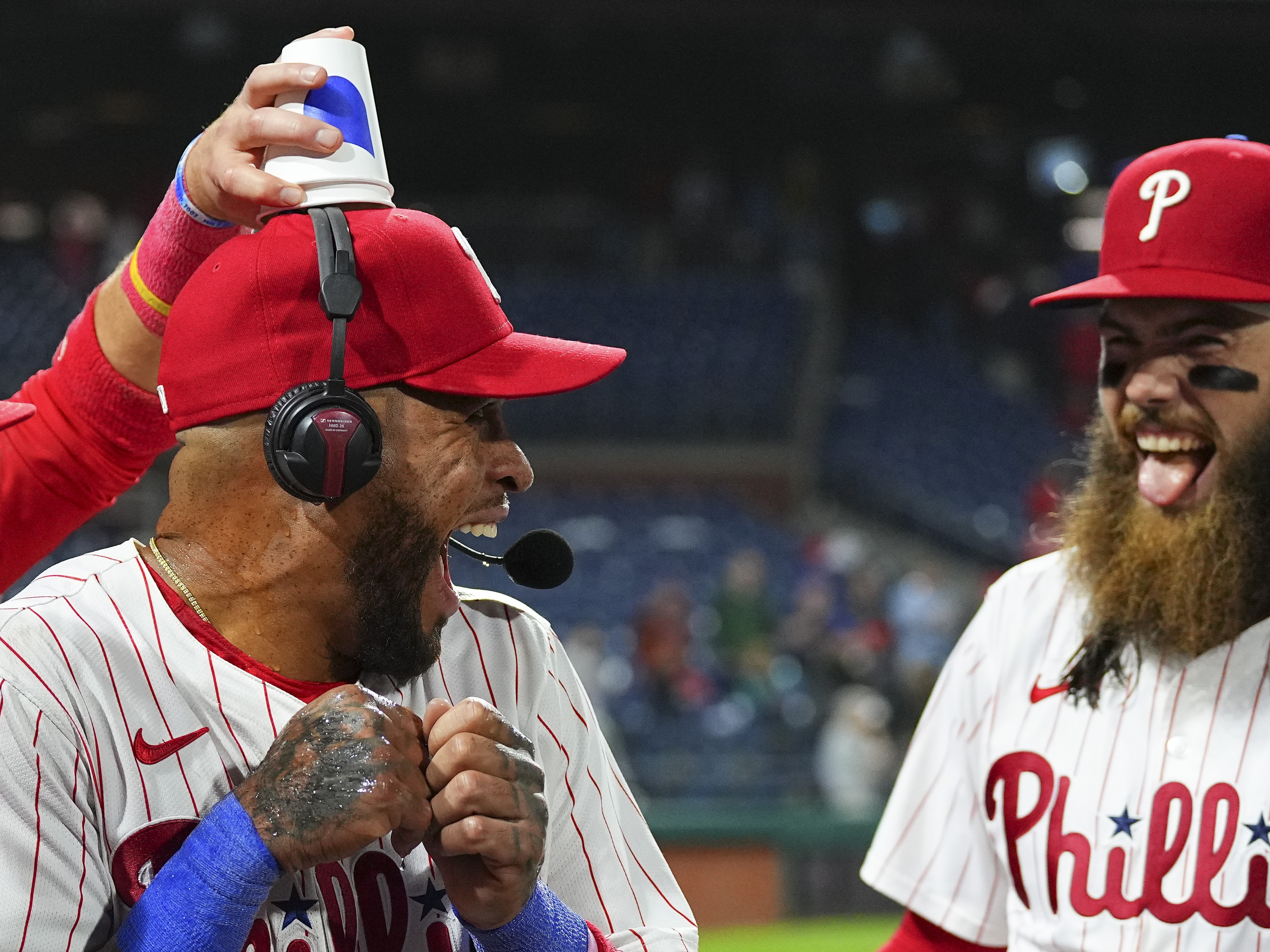 caption: Edmundo Sosa and Phillies teammate Brandon Marsh after a game against the New York Mets in May.
