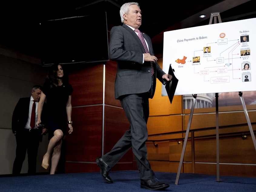 caption: A poster titled "China Payments to Bidens" is visible as House Committee on Oversight and Accountability Chairman Rep. James Comer Jr., R-Ky., arrives for a news conference on their investigation into the Biden Family on Capitol Hill in Washington, Wednesday, May 10, 2023. (AP Photo/Andrew Harnik)