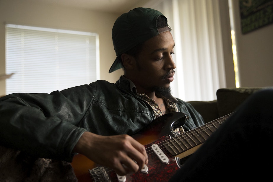 caption: Lamont Hendrix, banker and musician, at his home in Seattle.
