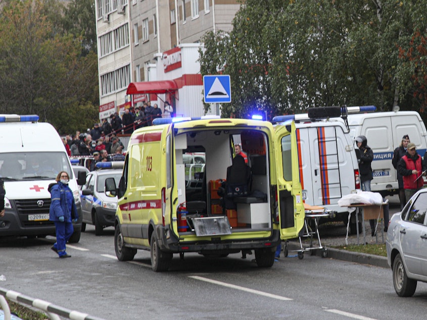 caption: Police and paramedics work at the scene of a shooting at school No. 88 in Izhevsk, Russia, Monday, Sept. 26, 2022. A gunman on Monday morning killed 13 people and wounded 21 others in a school in central Russia, authorities said.
