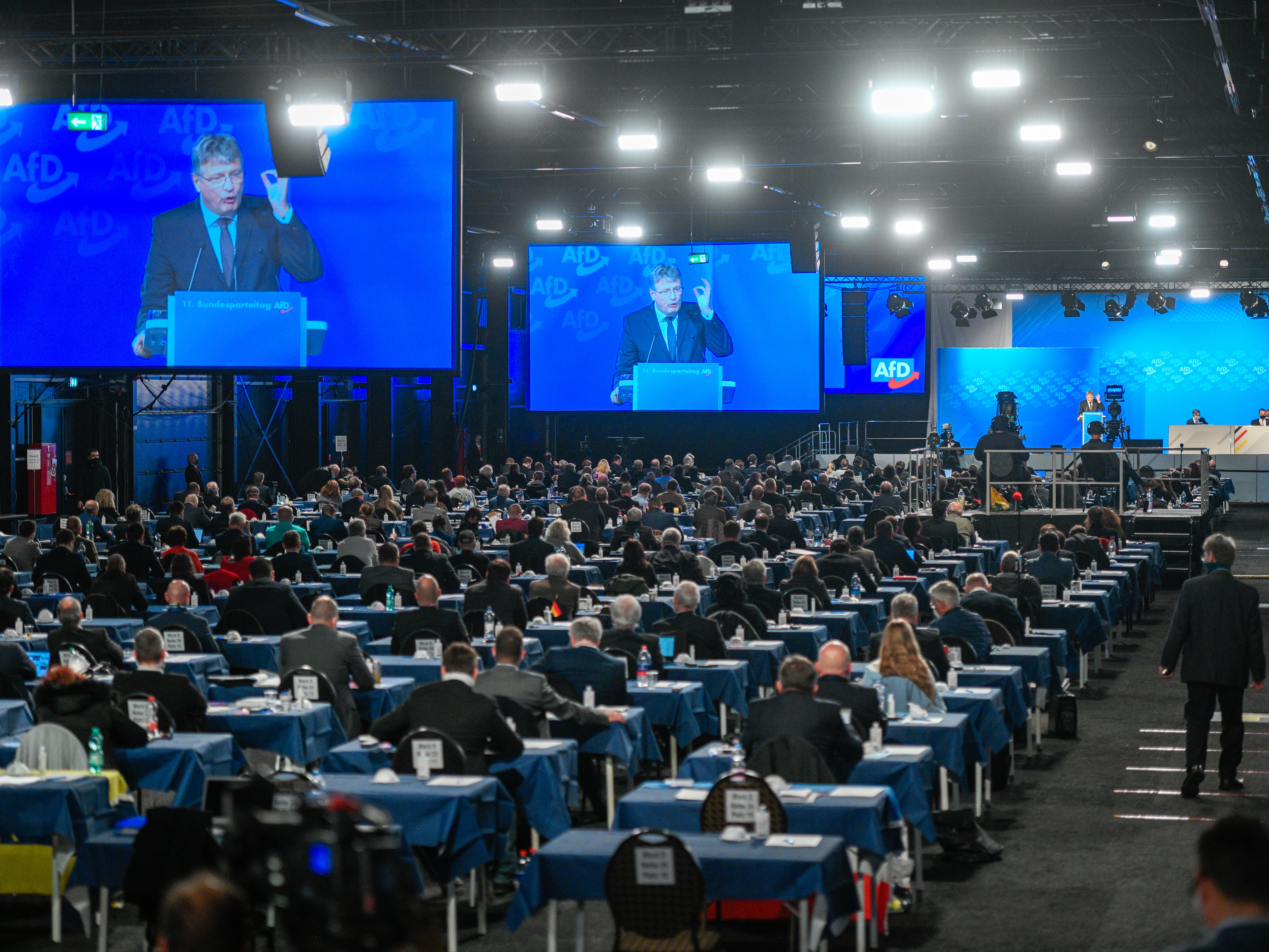 caption: Jörg Meuthen, co-federal leader of the Alternative for Germany (AfD) political party, speaks at the party congress Nov. 28, in Kalkar, Germany. Meuthen criticized the party's right wing in his speech. The AfD held the two-day congress in person, as total confirmed coronavirus infections passed the 1 million mark.