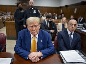 caption: Former President Donald Trump attends his trial in Manhattan criminal court on May 2. The judge in the case heard arguments related to the prosecution's request to fine Trump for violating a gag order in the case.