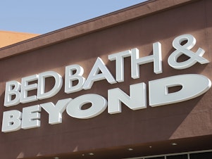 caption: A Bed Bath & Beyond sign is displayed in 2012, in Mountain View, Calif. Overstock.com is dumping its name online and becoming Bed Bath & Beyond.