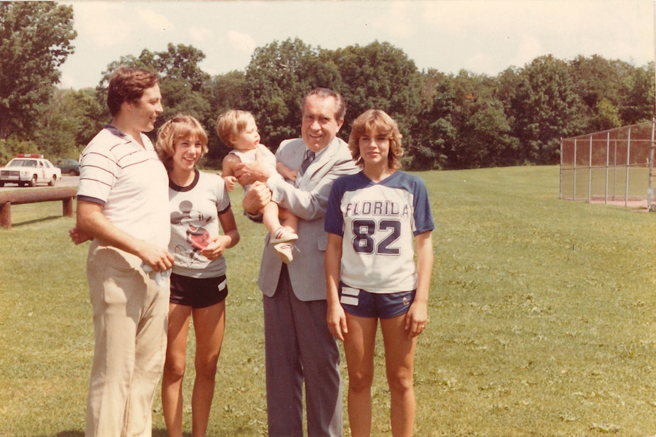 caption: Mike Endicott, far left, his daughters Robin and Leslie, and his son David, pose with former President Richard Nixon. “For three years we had the picnic here. We had an area where we set it up, where people could sit. There was a ball field, competitions with the kids. Nixon handed out prizes and stuff,” Endicott said.