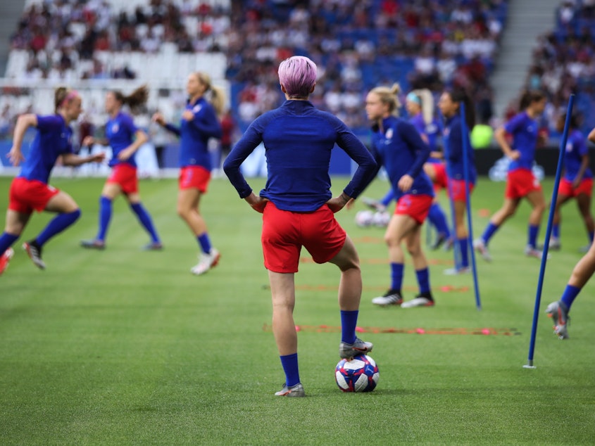caption: The Netherlands are the last team standing between the United States and its fourth Women's World Cup. Here, U.S. forward Megan Rapinoe watches her teammates warm up before Tuesday's 2-1 semifinal win over England.
