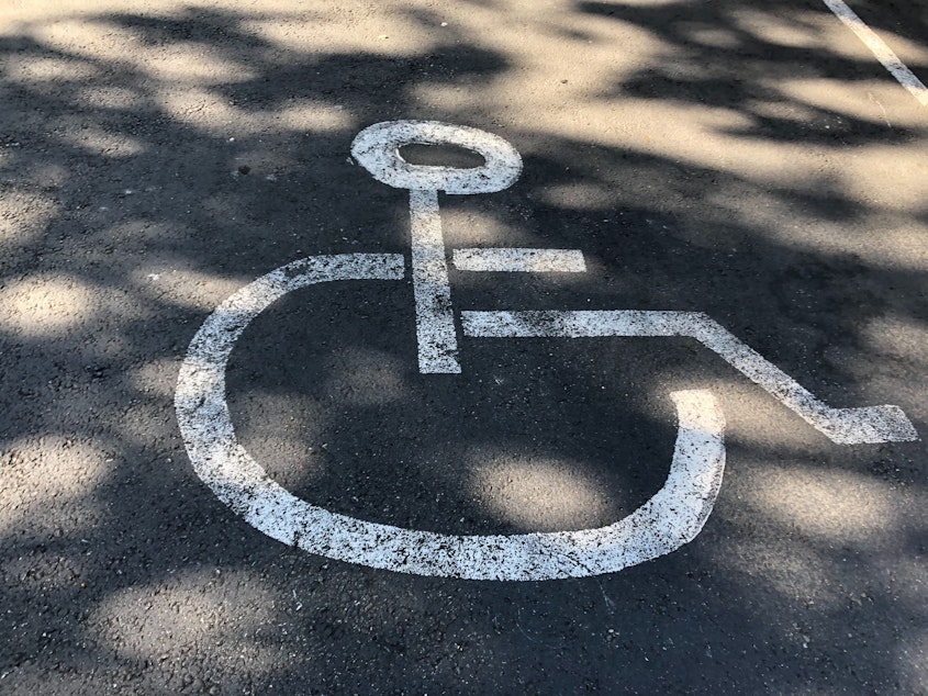 caption: Disability rights advocates worry that businesses will use disability parking for outdoor dining or retail space.