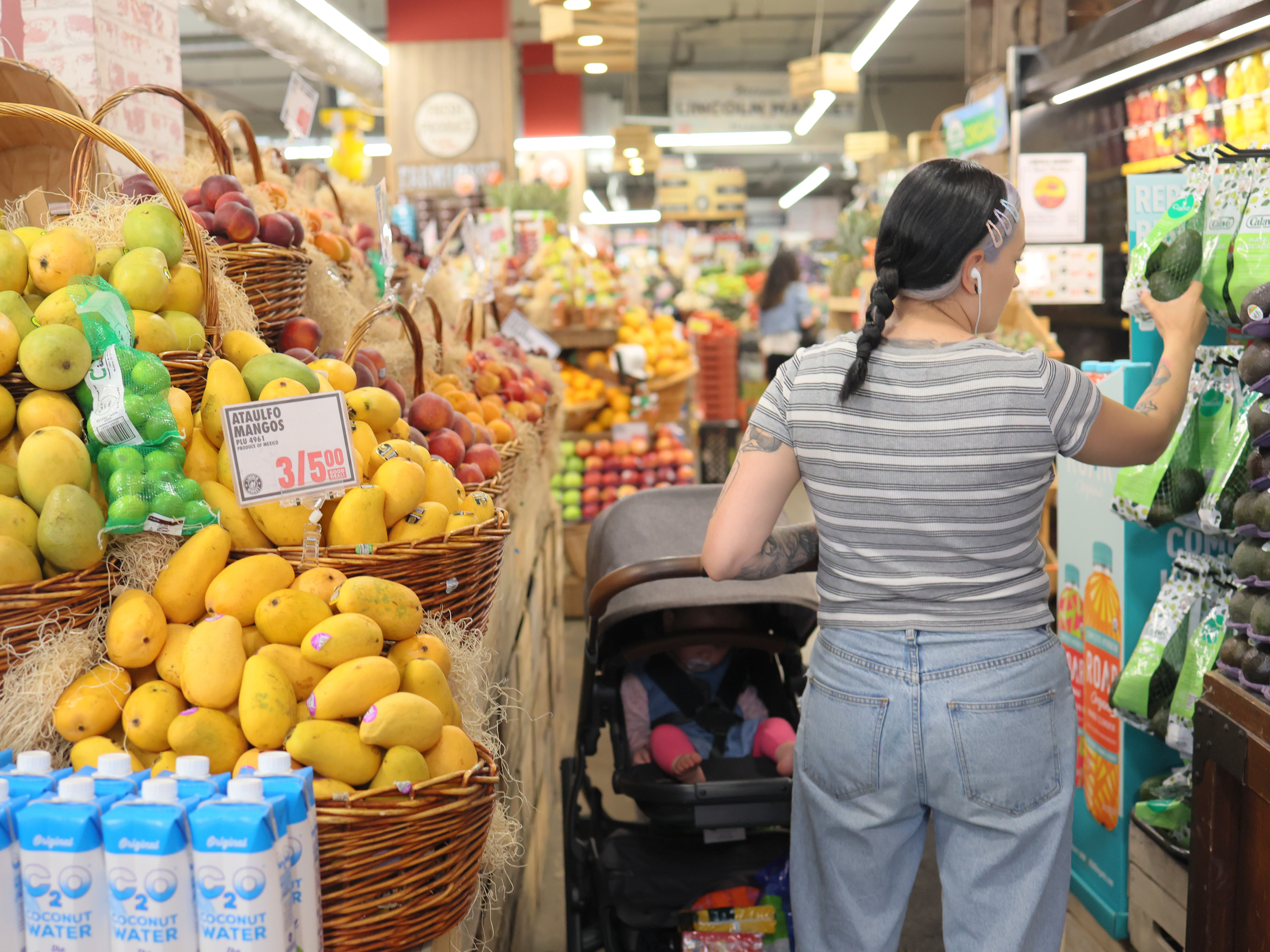 caption: People shop at a market in Brooklyn, New York City, on June 12, 2023.