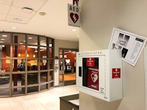 caption: Some sixty "Opiod Overdose Kits" have been added defibrillator boxes in Bridgewater State University dorms and academic buildings like this one.
