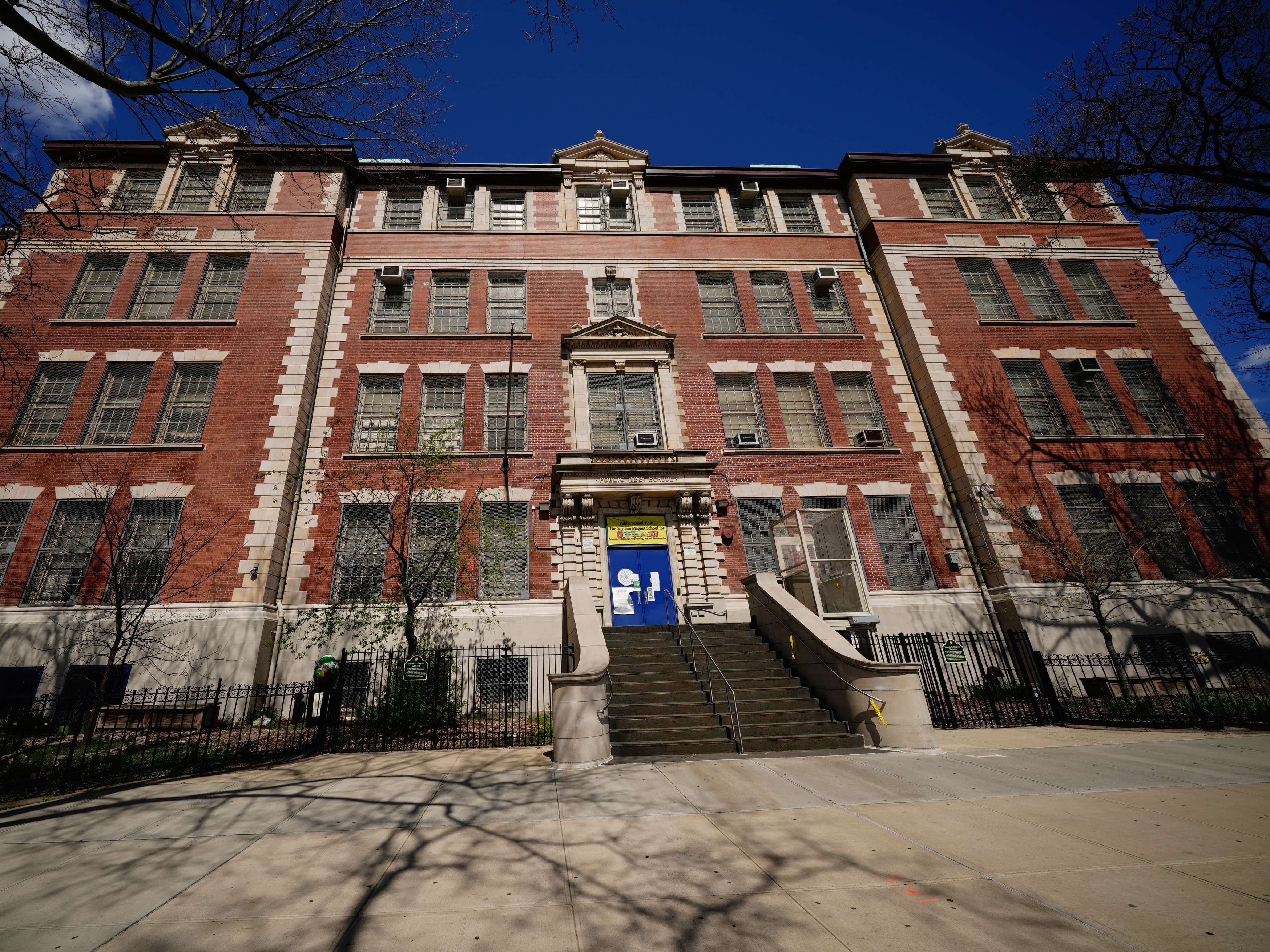 caption: A view of the Suydam Magnet School for STEAM, in Brooklyn, N.Y. On Saturday, New York City Mayor Bill de Blasio announced the city's public schools would remain closed through the end of the academic year.