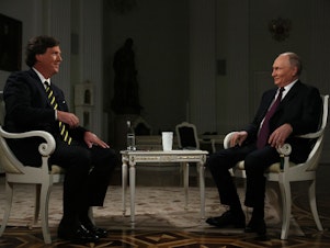 caption: Russia's President Vladimir Putin gives an interview to Tucker Carlson at the Kremlin in Moscow.