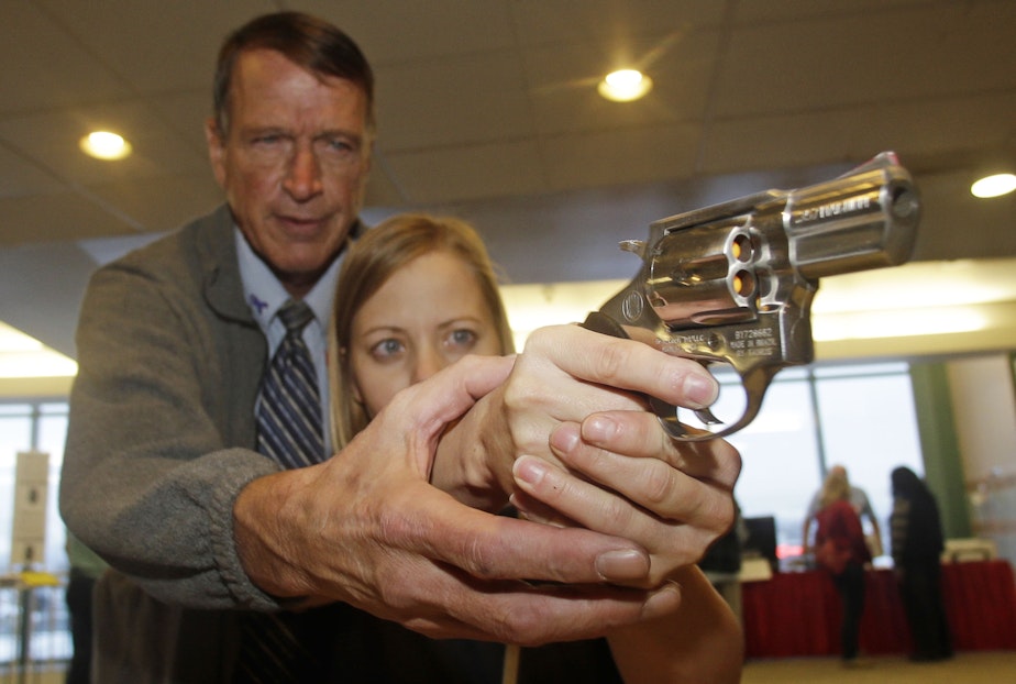 caption: In this Dec. 27, 2012 file photo, Cori Sorensen, a fourth grade teacher from Highland Elementary School in Highland, Utah, receives firearms training with a .357 magnum from personal defense instructor Jim File: Decduring concealed weapons training for 20