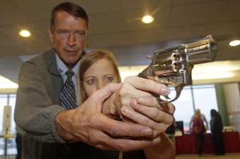 caption: In this Dec. 27, 2012 file photo, Cori Sorensen, a fourth grade teacher from Highland Elementary School in Highland, Utah, receives firearms training with a .357 magnum from personal defense instructor Jim File: Decduring concealed weapons training for 20
