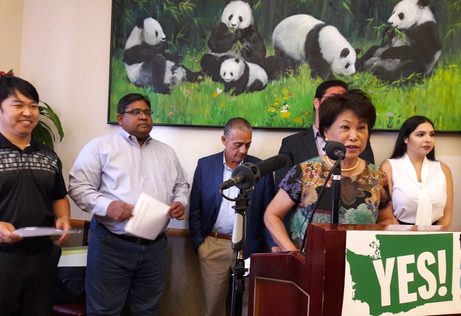 caption: Martha Lee, president of the Ethnic Chambers of Commerce, announces the group's support of I-1634.
