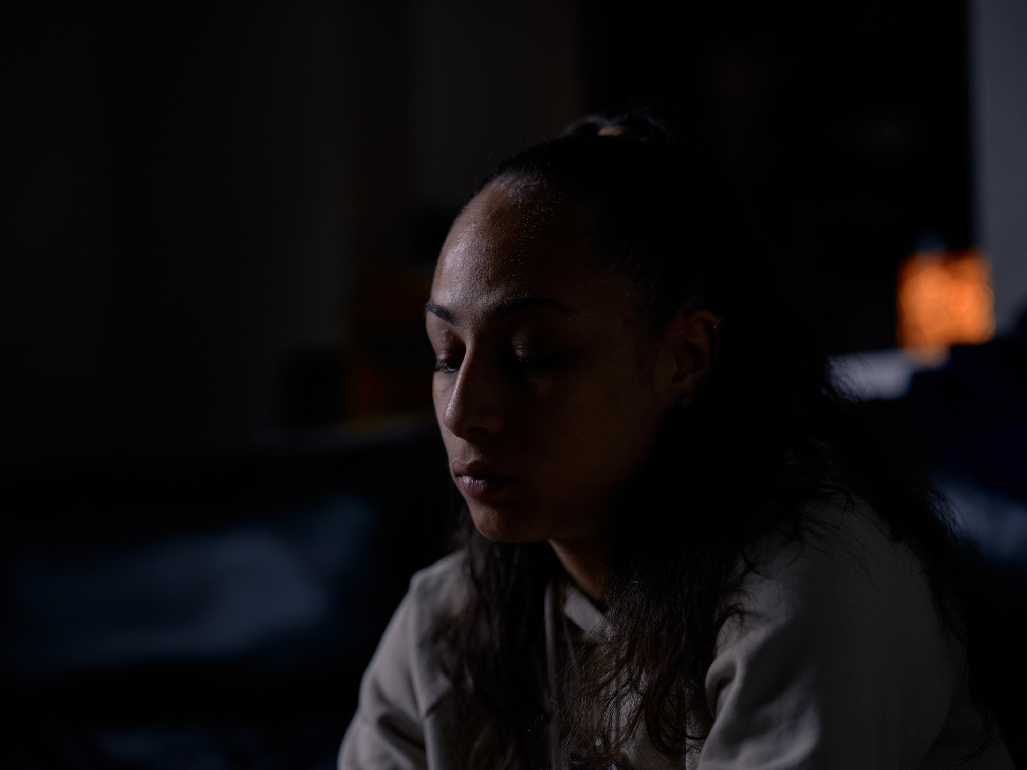 caption: Portrait of Allyssa Lewis in her living room in Richardson, Texas, on April 4, 2022.