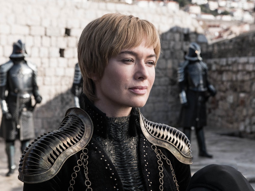 caption: Queen Cersei (Lena Headey) smiling that smile of hers on <em>Game of Thrones.</em> Shoulder pads courtesy of Julia Sugarbaker.