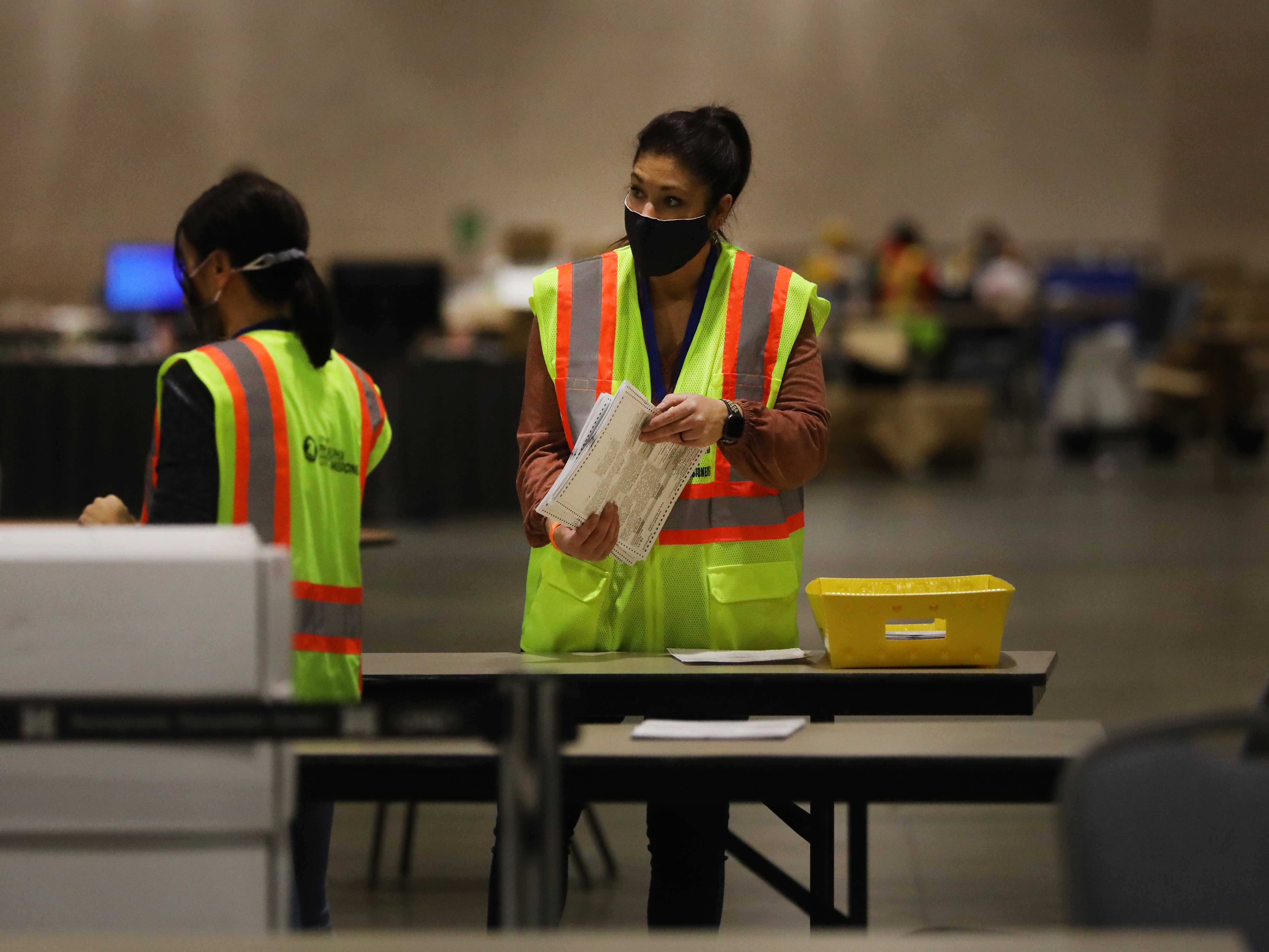 caption: Election workers in Philadelphia count ballots on Tuesday. Pennsylvania is among several swing states that have yet to be called.
