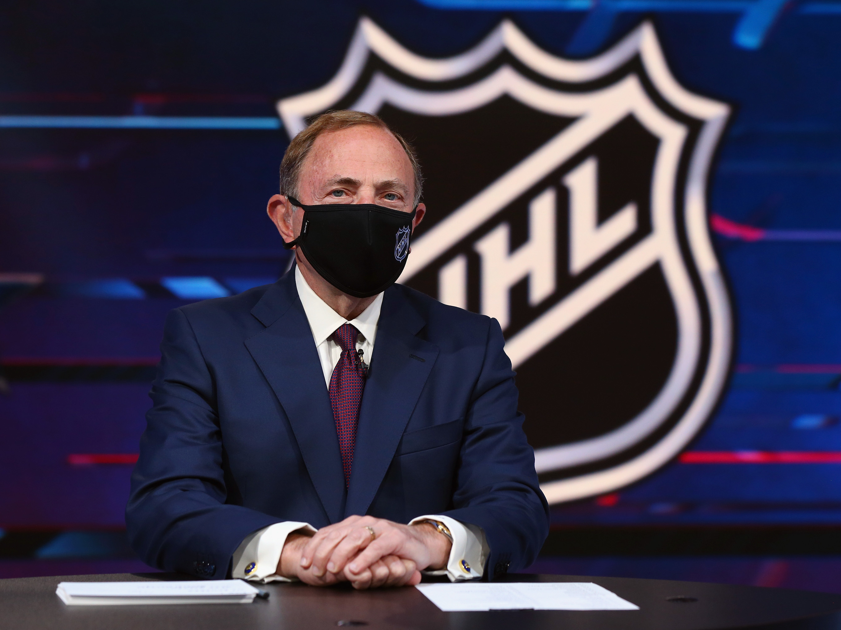 caption: NHL commissioner Gary Bettman prepares for the first round of the 2020 National Hockey League Draft at the NHL Network Studio on October 06, 2020 in Secaucus, New Jersey.