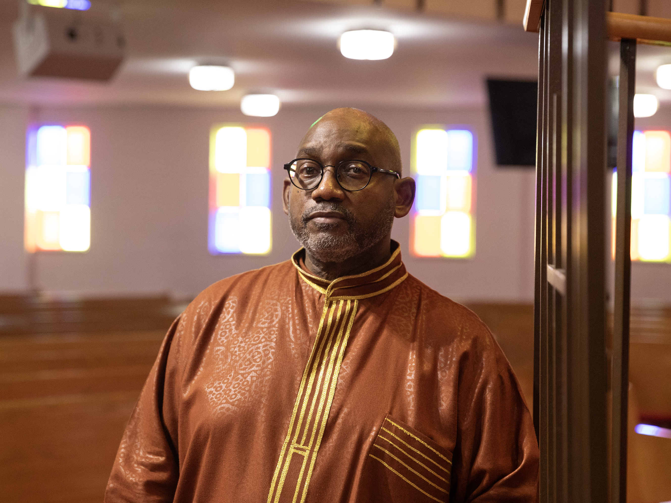 caption: Reverend Kenneth James Flowers, 62, Senior Pastor of Greater New Mt. Moriah Missionary Baptist Church, poses for a portrait after service on Sun., Feb. 25, 2024 in Detroit, Michigan.